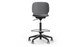 arhus Swivel Counter Stool by Quell Design in black positioned around a modern kitchen island with wooden countertops and pendant lighting. Featuring a smooth moulded polypropylene seat, adjustable gas-lift height, 360-degree swivel, integrated footrest ring, and sturdy five-star base, this Scandinavian-inspired stool blends ergonomic comfort with minimalist contemporary style for residential and commercial interiors.
