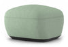 Byorne Low Back Stool in dusty teal, dark grey and pebble upholstery, featuring a compact sculpted form with a low contemporary profile. Built with high-density moulded foam and a welded steel internal frame for lasting comfort and structure, the stool is supported by injected-moulded nylon legs for stability. Designed to integrate seamlessly with other Byorne modular seating elements or function as a standalone piece in lounges, reception areas and modern hospitality interiors.
