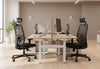 Two Fokus Comfort Chairs are prominently featured in a modern and bright office environment. These black ergonomic mesh office chairs offer excellent support for long hours of work, making them ideal for any productive workspace. The chairs are positioned at light wood desks with white legs, showcasing a comfortable and functional office setup. This image highlights the sleek design and practical features of the chair, perfect for businesses seeking high-quality office seating solutions.