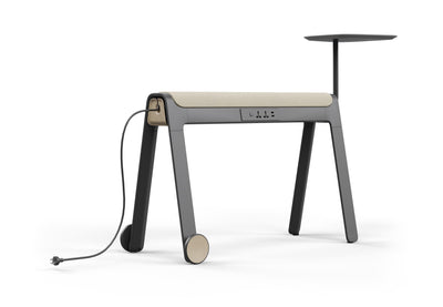 The LinForm Hybrid Workspace System shown on a white background. This modern workstation features a layered tabletop with an acoustic panel and powder-coated MDF surface for durability and sound absorption. It stands on aluminium legs with die-cast foot caps and PU wheels for easy mobility and includes a framed acoustic screen, a Gabriel fabric-wrapped cushion and a built-in multifunctional socket for flexible, connected workspaces.