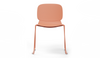 Aarhus Bistro Glide Stackable Chair by Quell Design – sculptural modern chair in coral moulded polypropylene shell and sleek electrostatic powder-coated steel frame. The ergonomic, contoured seat offers comfort while its stackable design makes it perfect for dynamic office, café or communal spaces.
